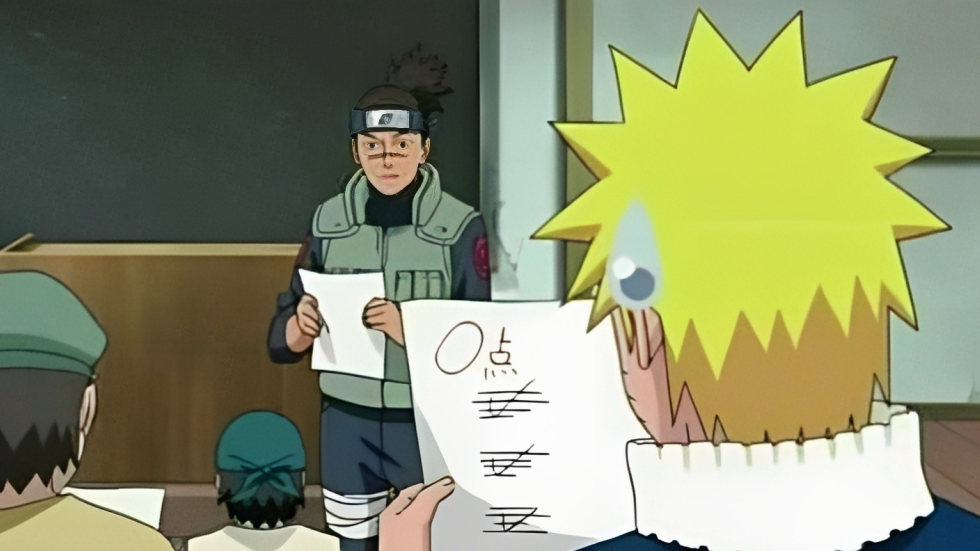 Imagem de cena do anime “Naruto” onde a personagem recebe uma prova com nota 0 mesmo tendo acertado as questões